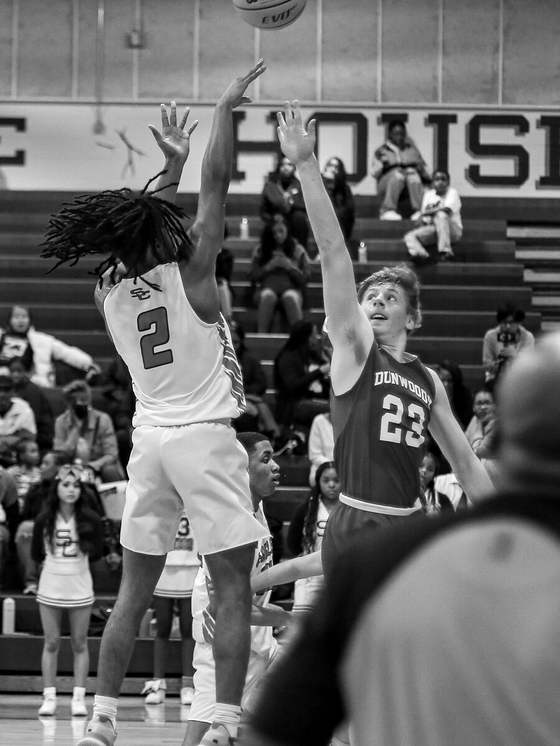 Player rising over the contest